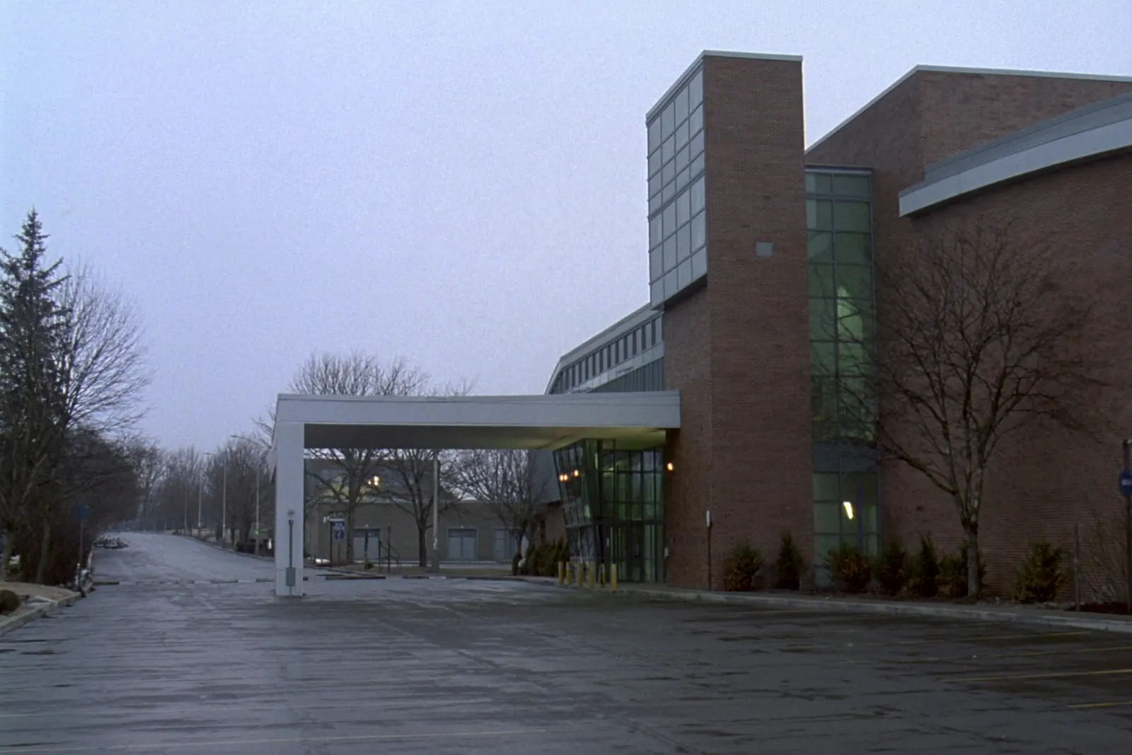 The exterior of a suburban community recreation centre on an overcast day.
